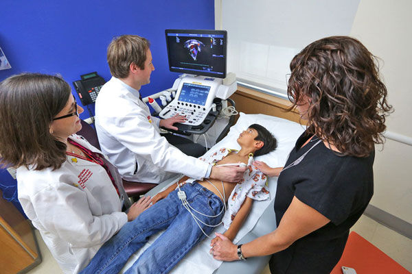 Child Having Echocardiogram with Doctor